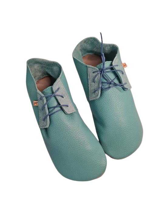 Soft leather slippers with lace-up closure for a perfect fit.