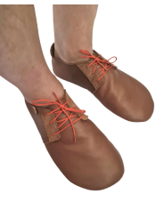 Soft leather slippers with lace-up closure for a perfect fit.