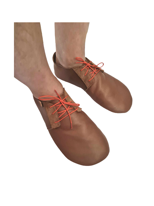 Soft leather slippers with lace-up closure for a perfect fit.