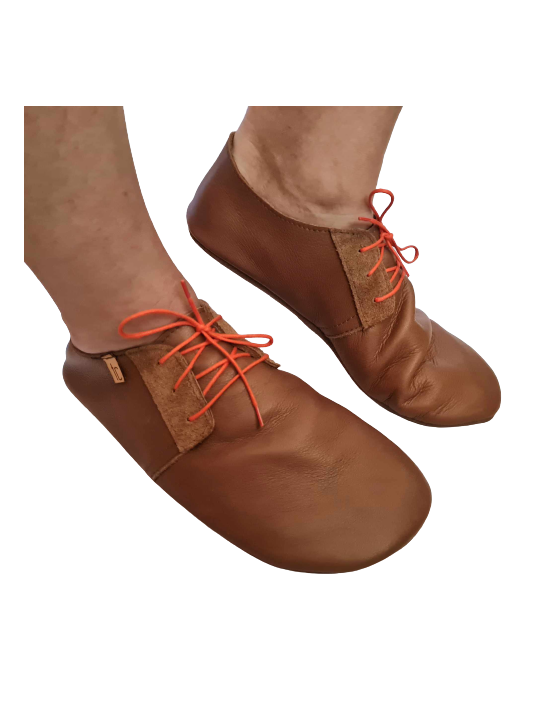 Soft leather slippers with lace-up closure for a perfect fit.